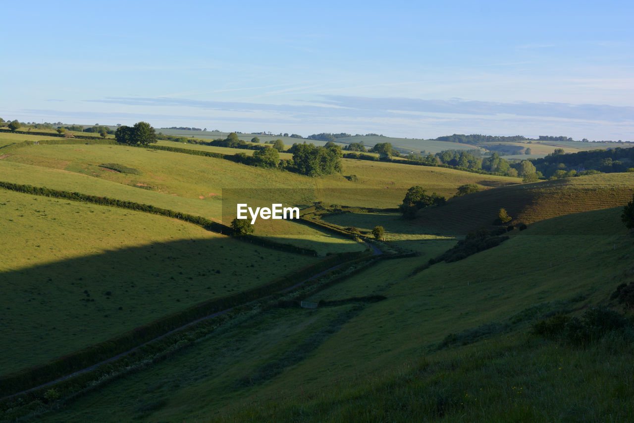 View towards poyntington along valley through green fields, oborne, sherbonre dorset, england.