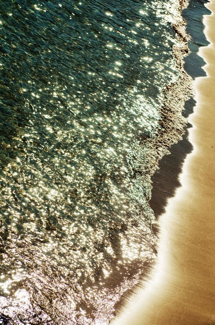 Close-up of waters edge at beach