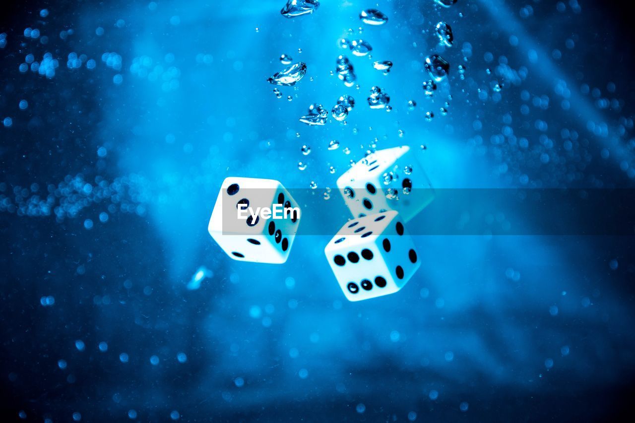 Close-up of dices in water