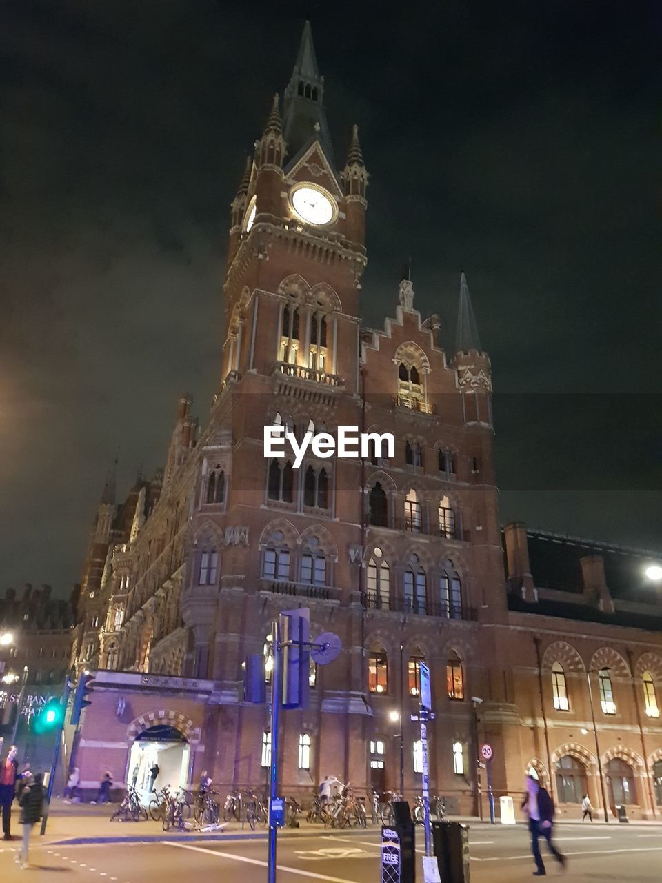 LOW ANGLE VIEW OF ILLUMINATED BUILDING AGAINST SKY