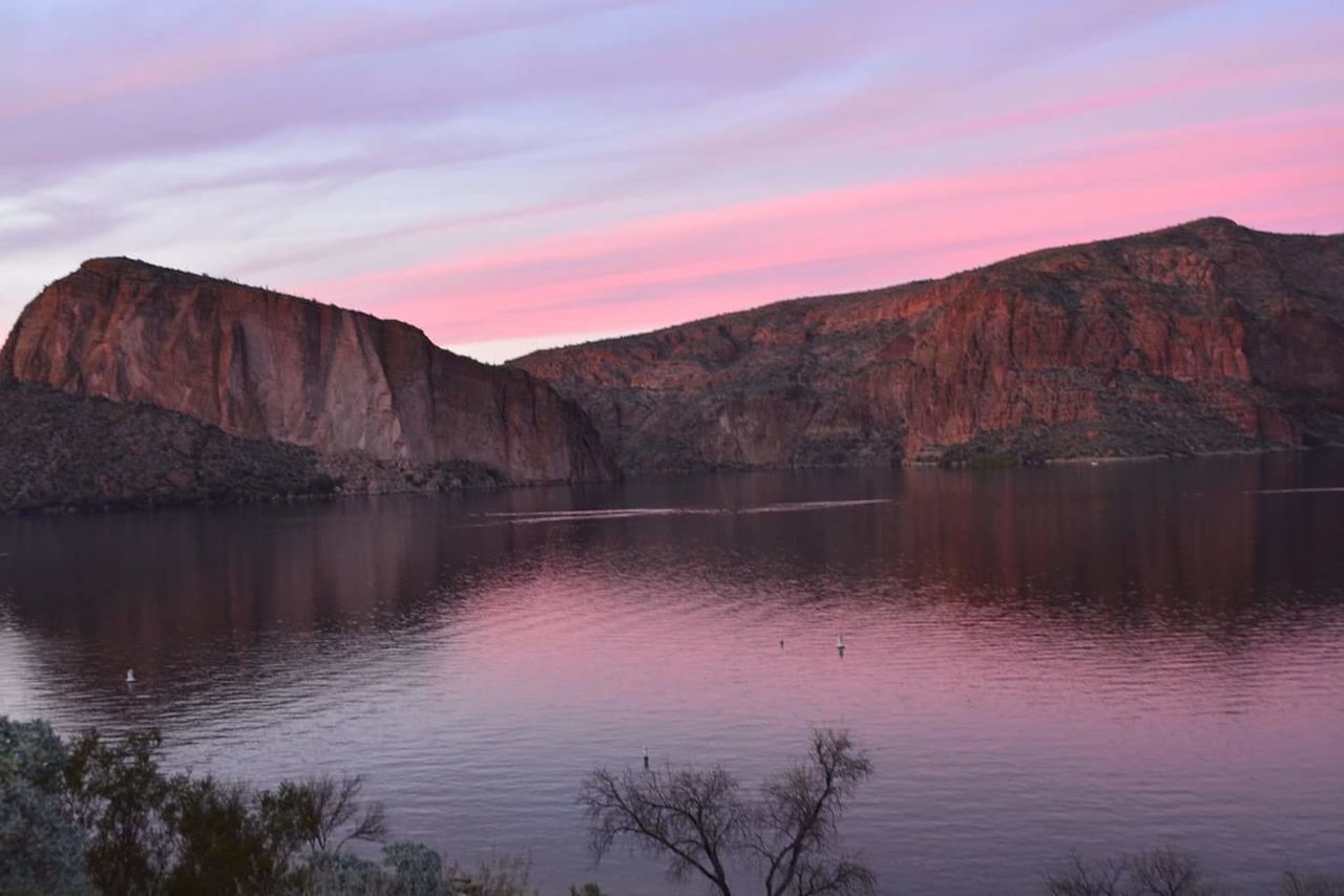 Scenic view of lake at sunset