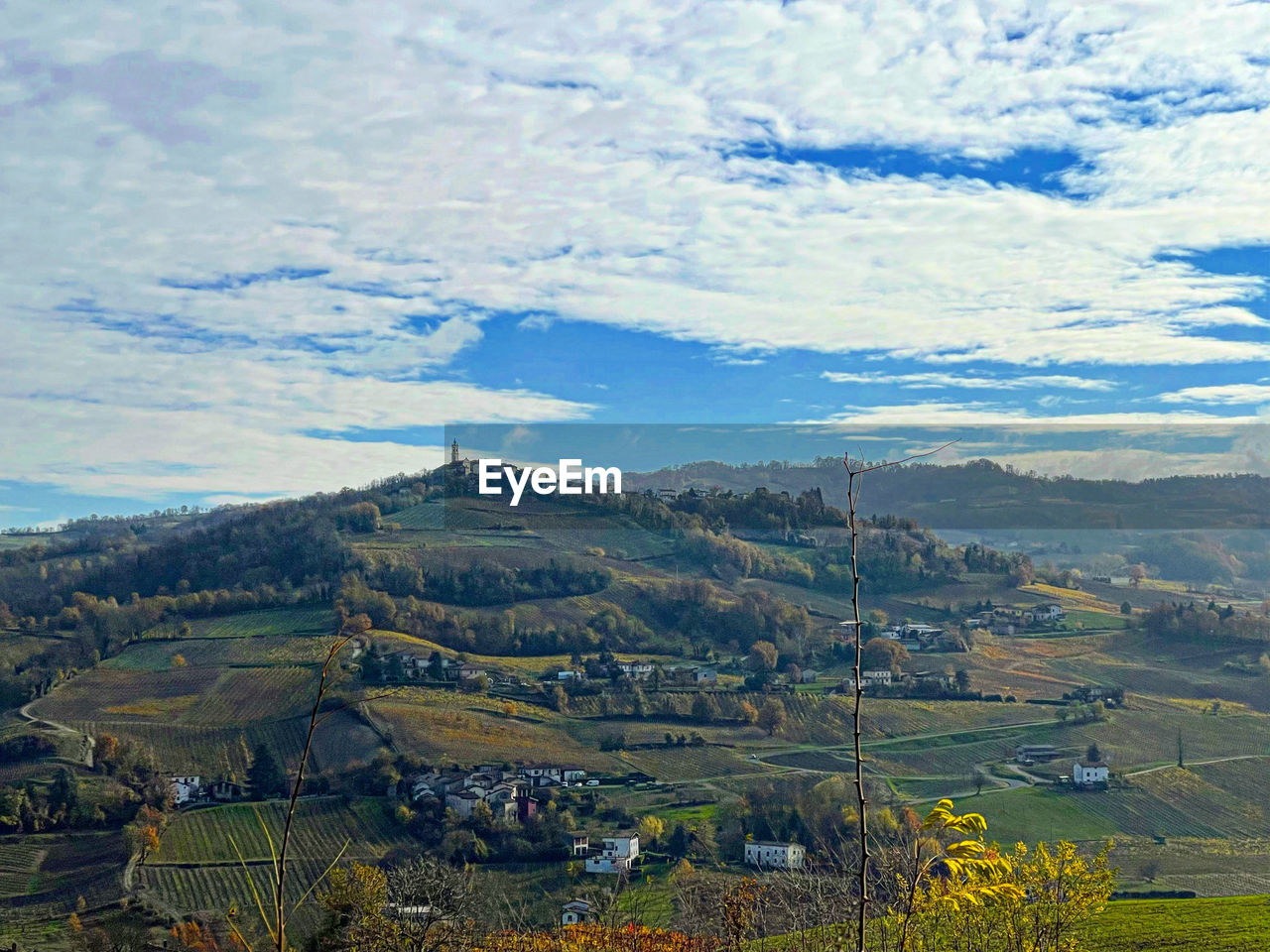 landscape, environment, scenics - nature, land, mountain, beauty in nature, sky, cloud, nature, mountain range, rural scene, field, agriculture, plant, tranquility, no people, tranquil scene, plateau, rural area, valley, tree, architecture, building, outdoors, travel, travel destinations, non-urban scene, farm, day, high angle view, crop, plain, horizon, aerial photography, social issues, village, growth, idyllic, tourism, house, meadow, blue, built structure