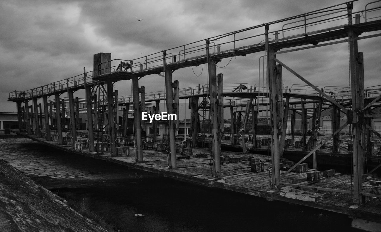 Old fishing wharf against sky