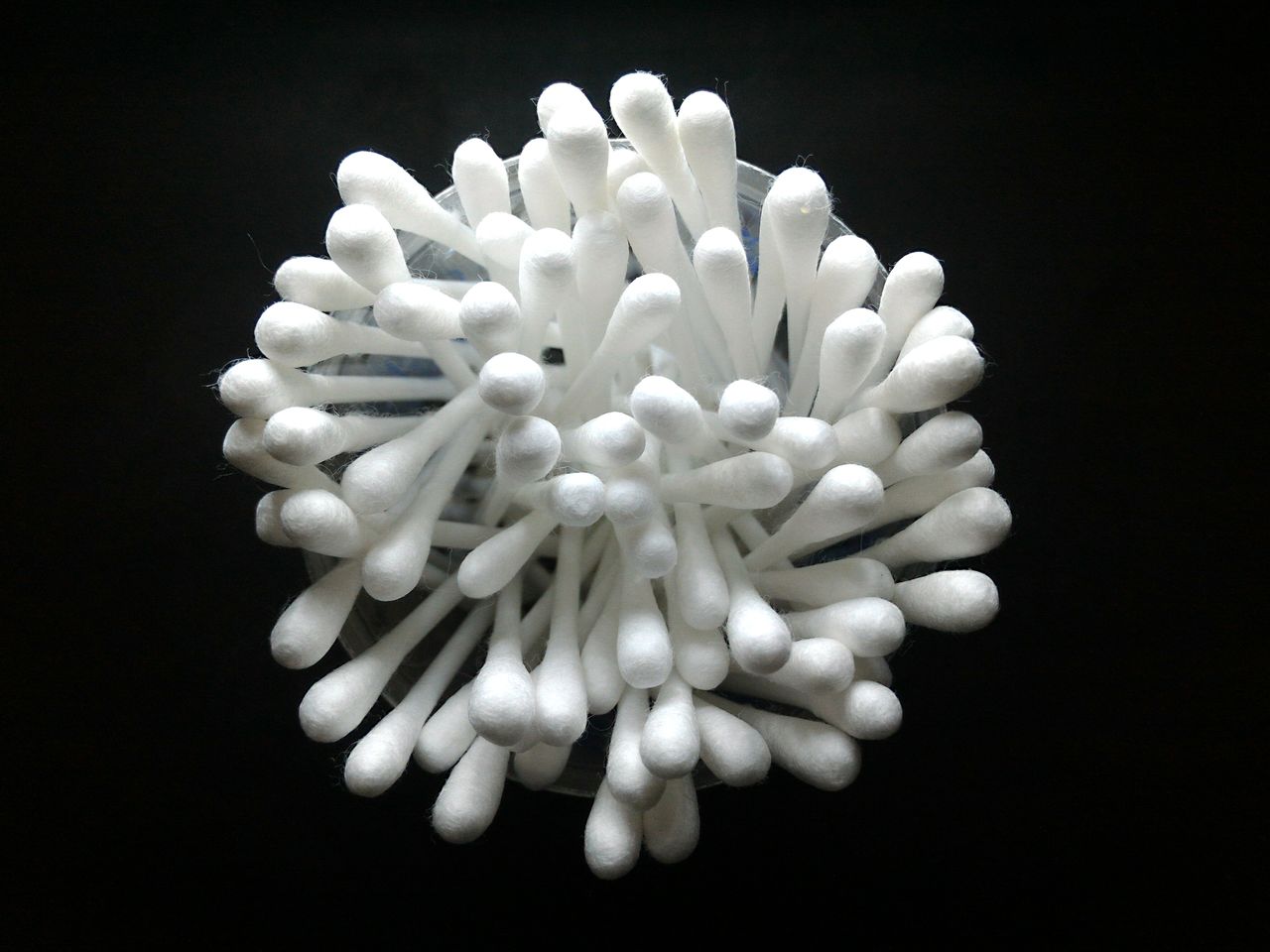 Close-up of cotton swab over black background