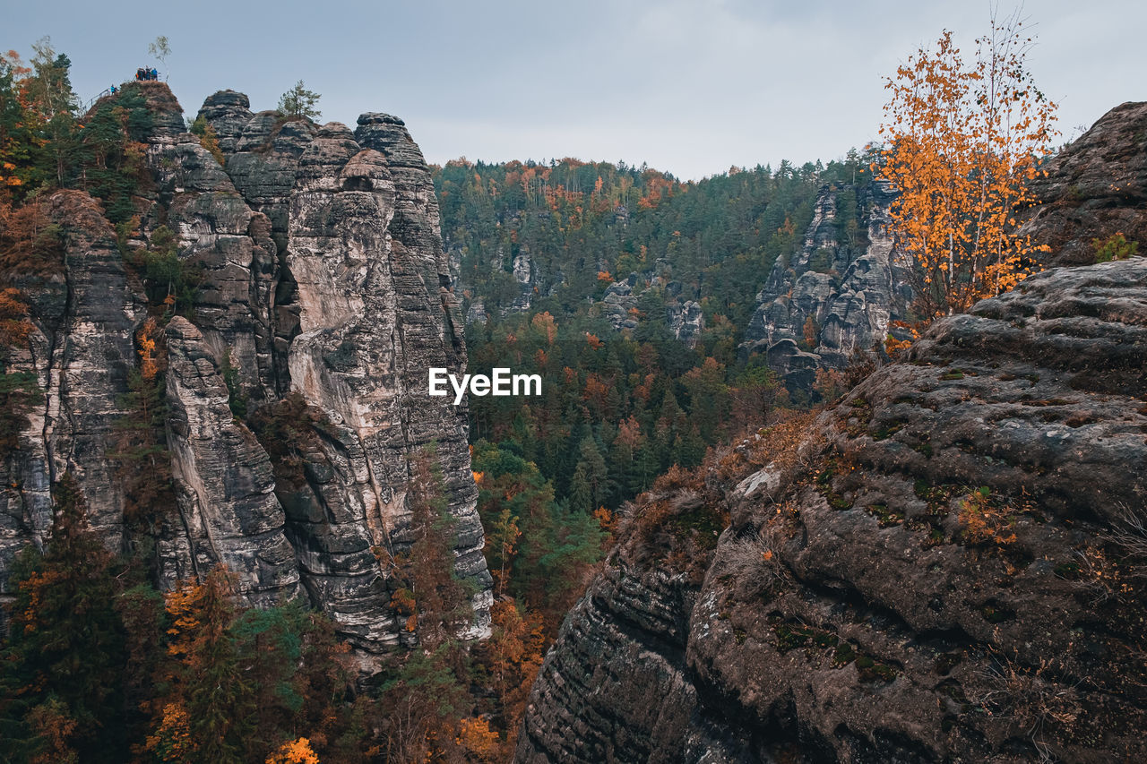 Scenic view of rocky mountains during autumn