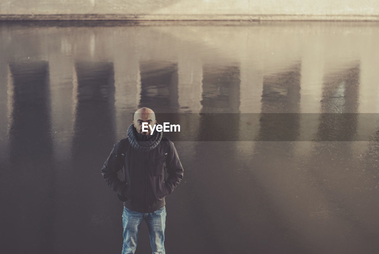 Rear view of woman standing in water