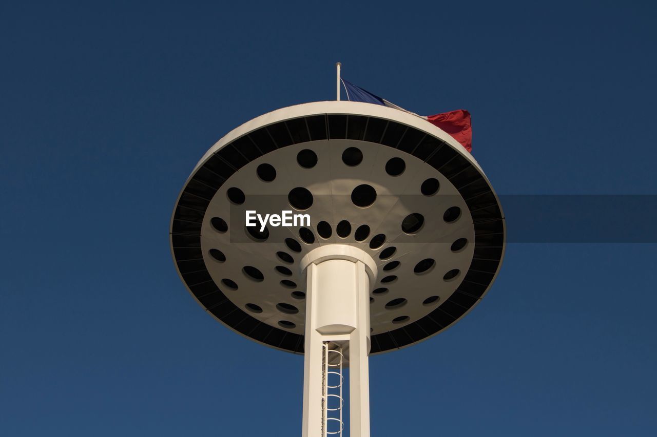 LOW ANGLE VIEW OF COMMUNICATIONS TOWER AGAINST SKY