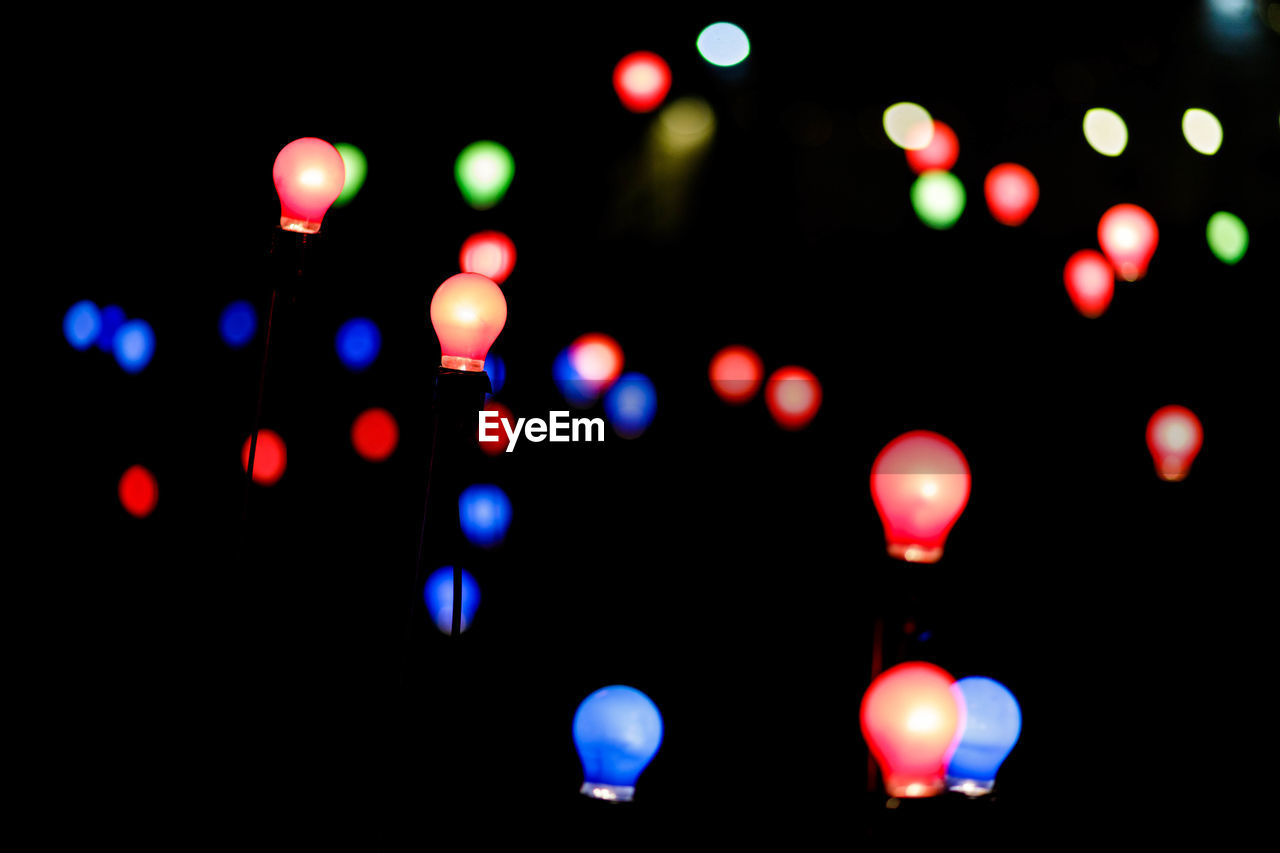 Defocused image of illuminated lights at night