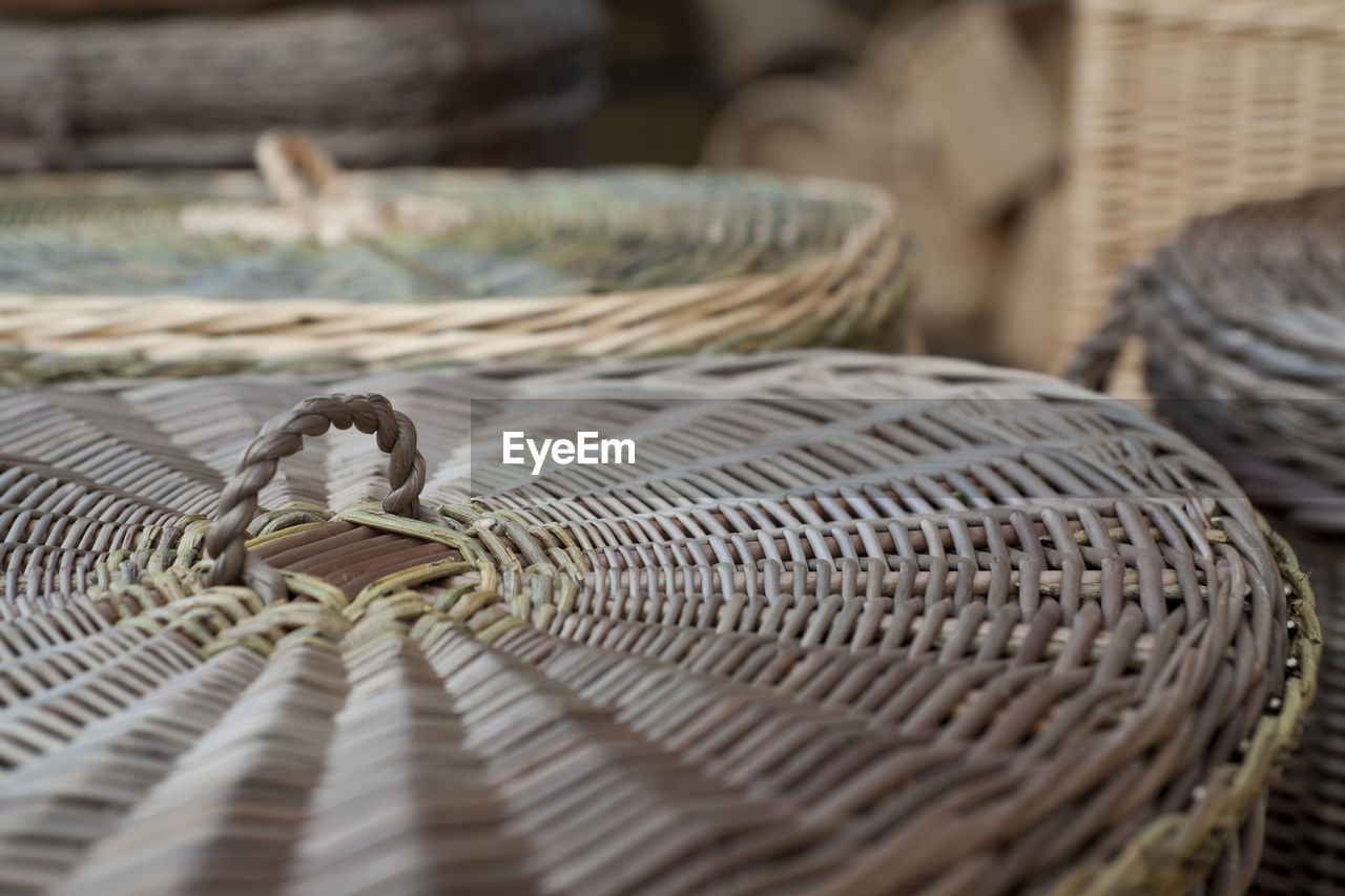 CLOSE-UP OF A CAT IN WICKER BASKET