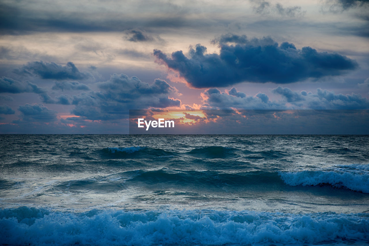 Scenic view of sea against sky during sunset