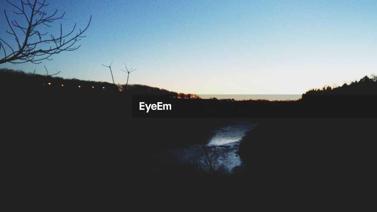 SCENIC VIEW OF SILHOUETTE TREES AGAINST CLEAR SKY