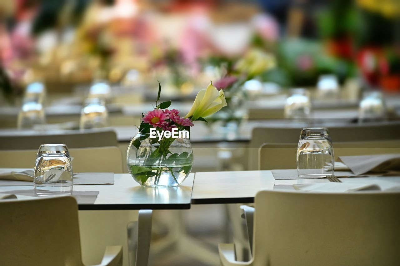 Empty chairs and tables in restaurant terrace