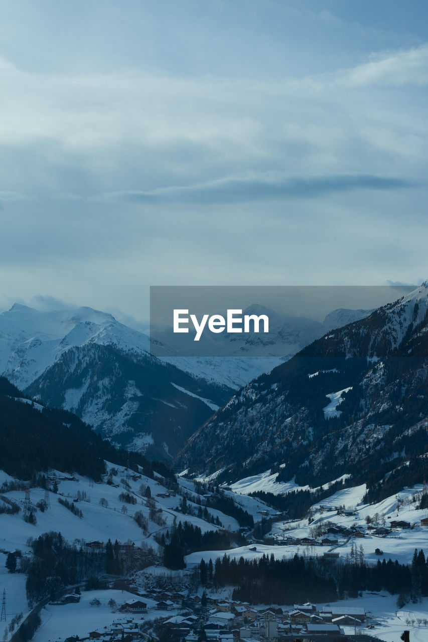 Scenic view of snowcapped mountains against sky