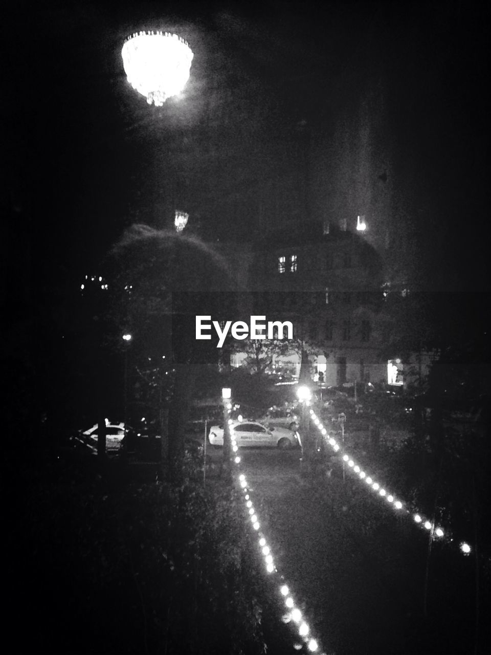 VIEW OF ILLUMINATED STREET LIGHTS IN NIGHT