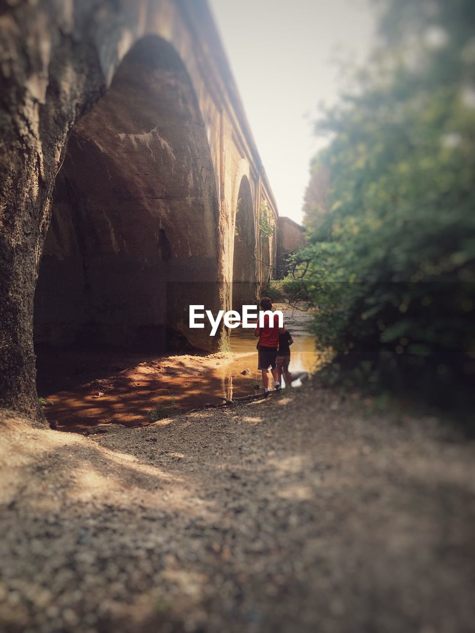 WOMAN WALKING ON WALKWAY