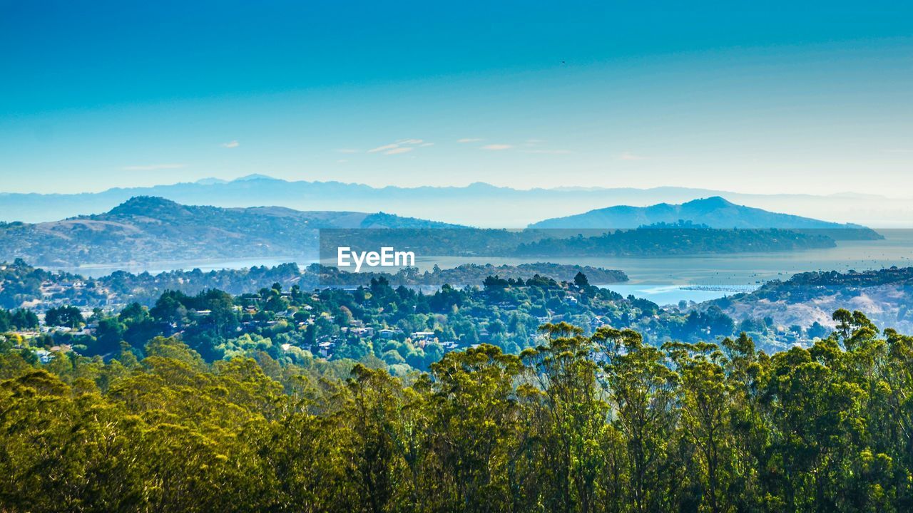 Scenic view of landscape and mountains against sky