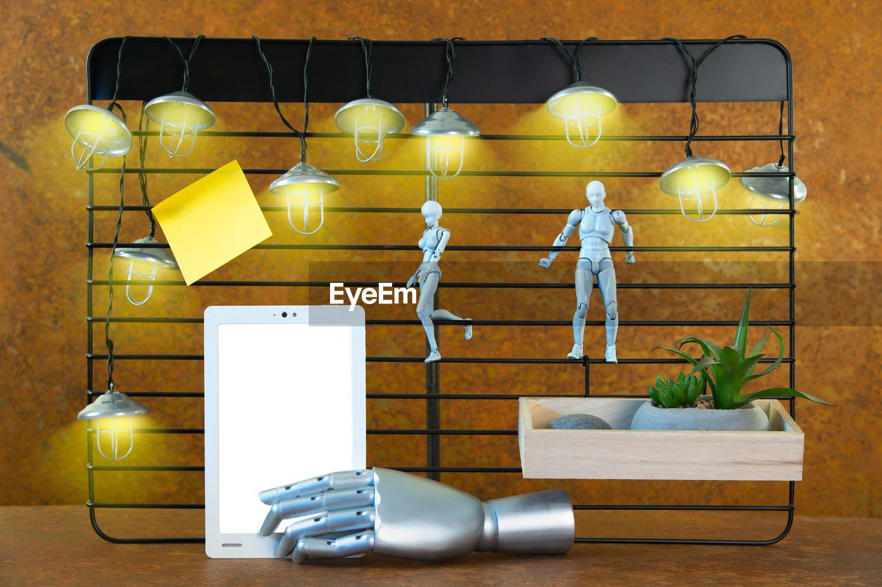 yellow, lighting, indoors, technology, wireless technology, no people, communication, wall, table