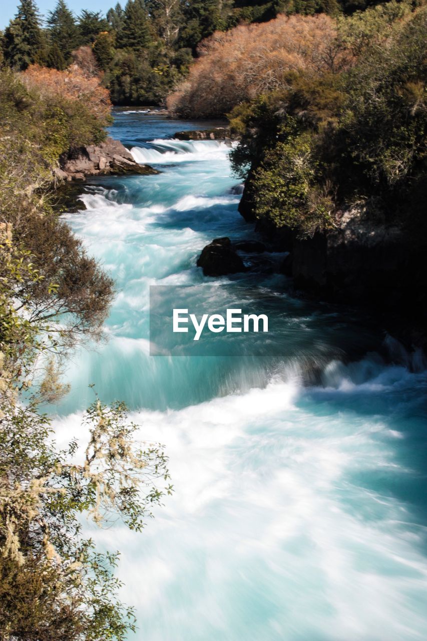 Scenic view of waterfall against sky