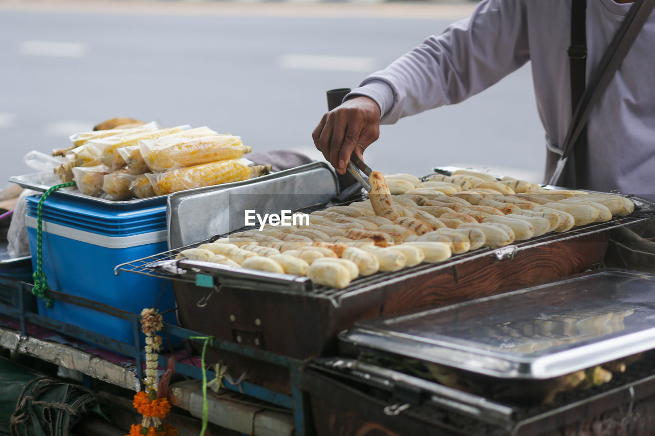 Grilled bananas are sold and prepared on the streets