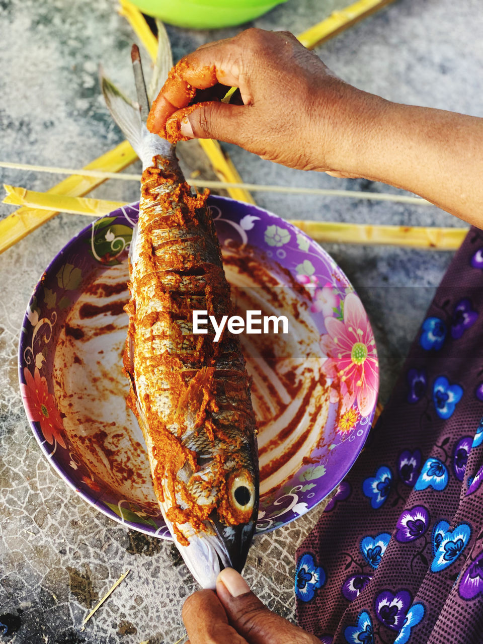 Cropped hand of person preparing food