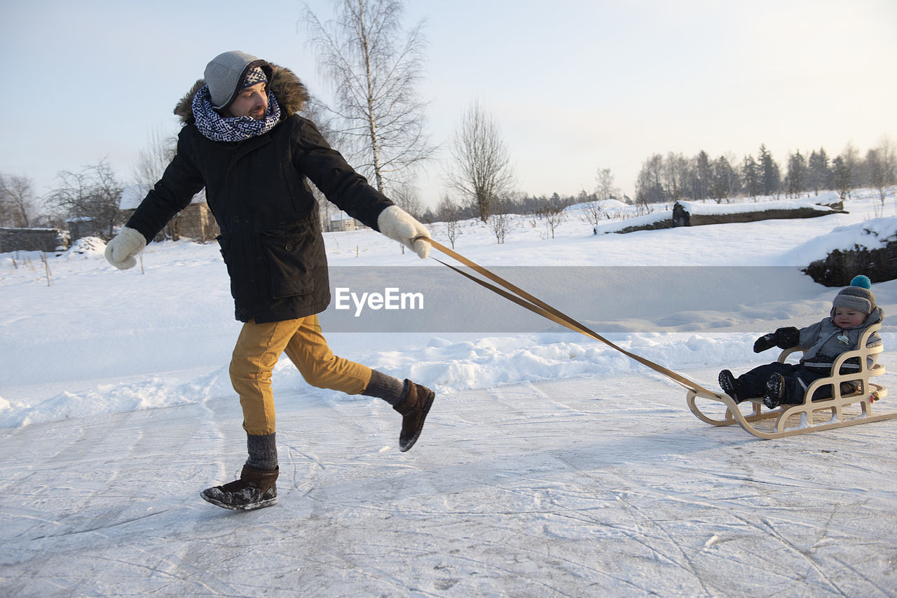 Full length of man on snow covered field