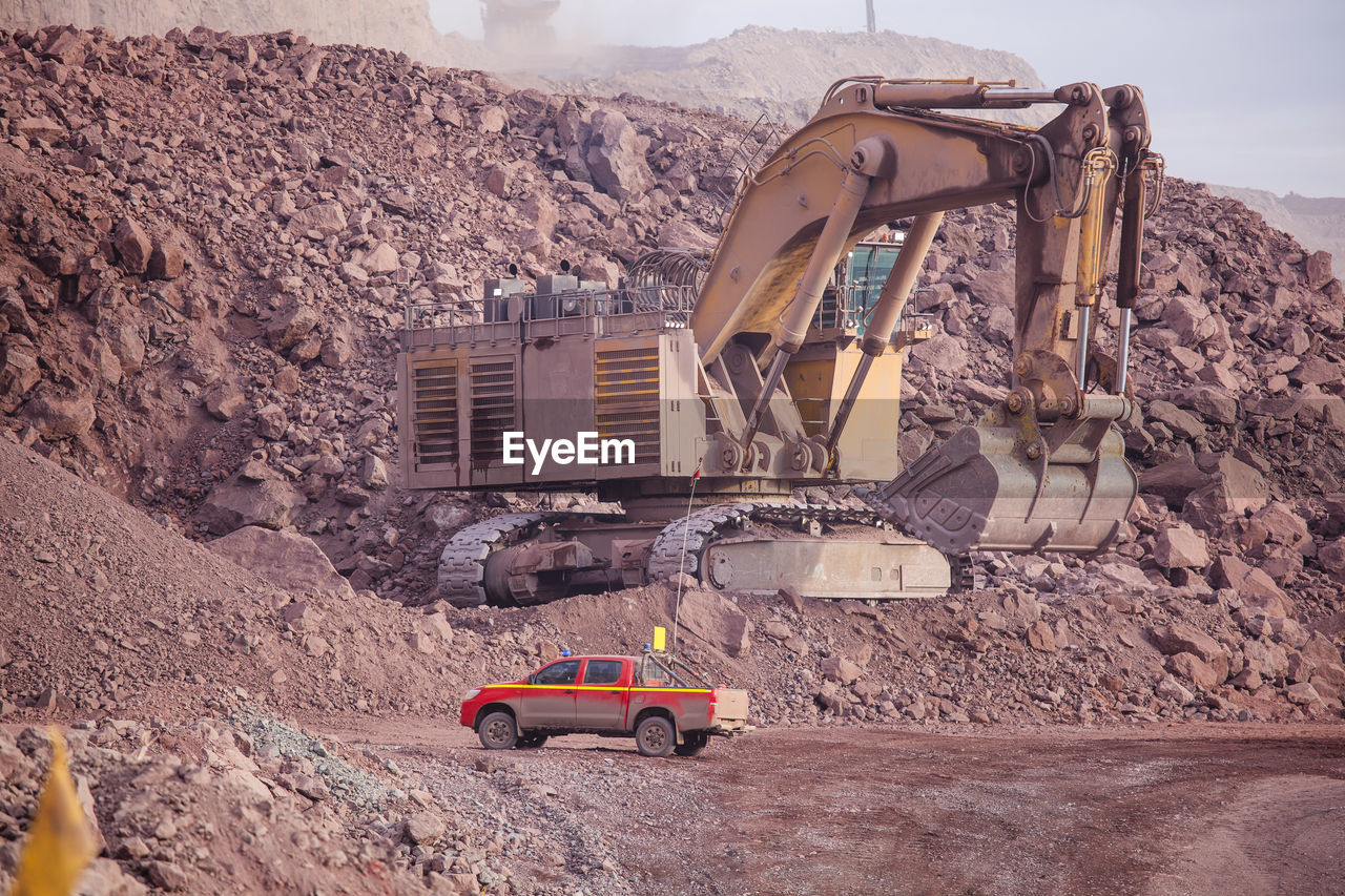 VIEW OF CONSTRUCTION SITE BY MOUNTAIN