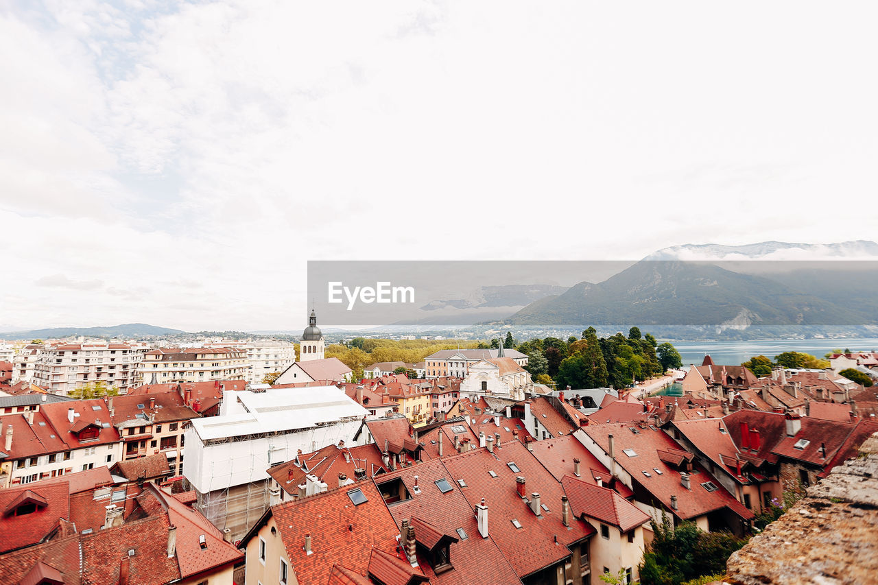 Annecy city top view, lake in the distance. tile roofs, cathedral. high quality photo