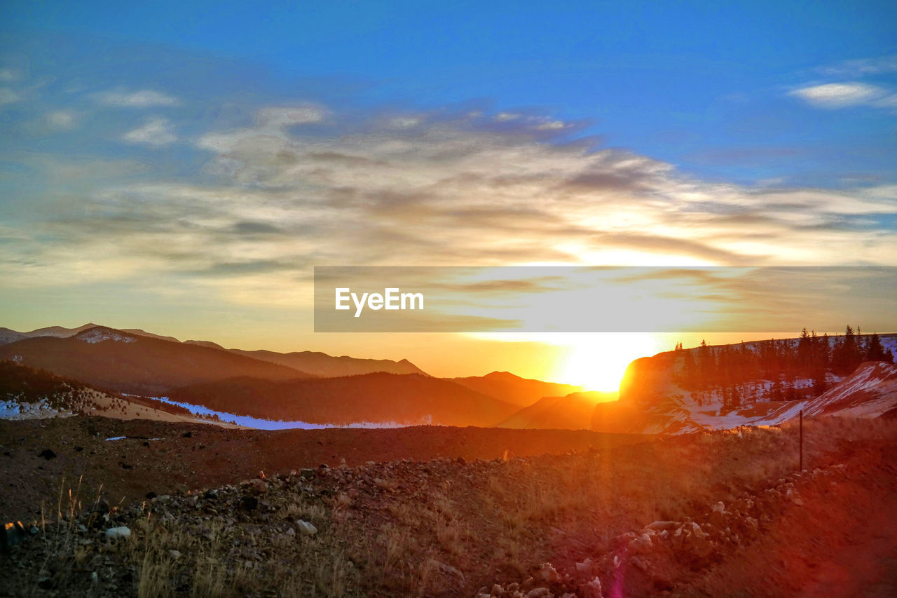 SCENIC VIEW OF SUNSET OVER LAND