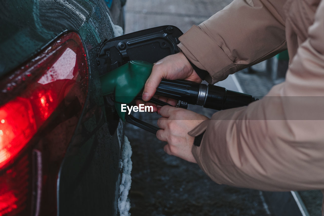 cropped hand of person holding camera