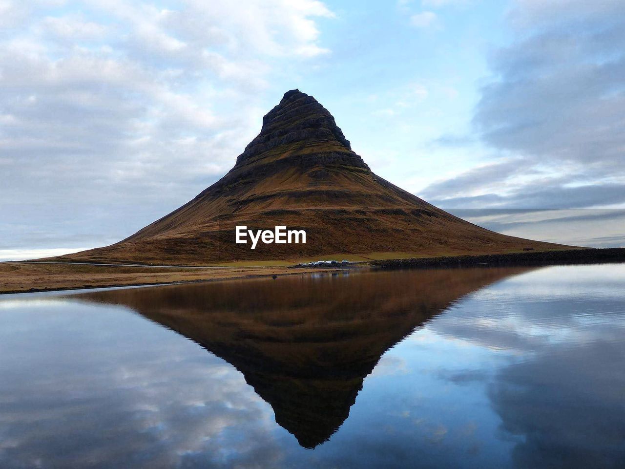 Reflection of mountain in lake against sky
