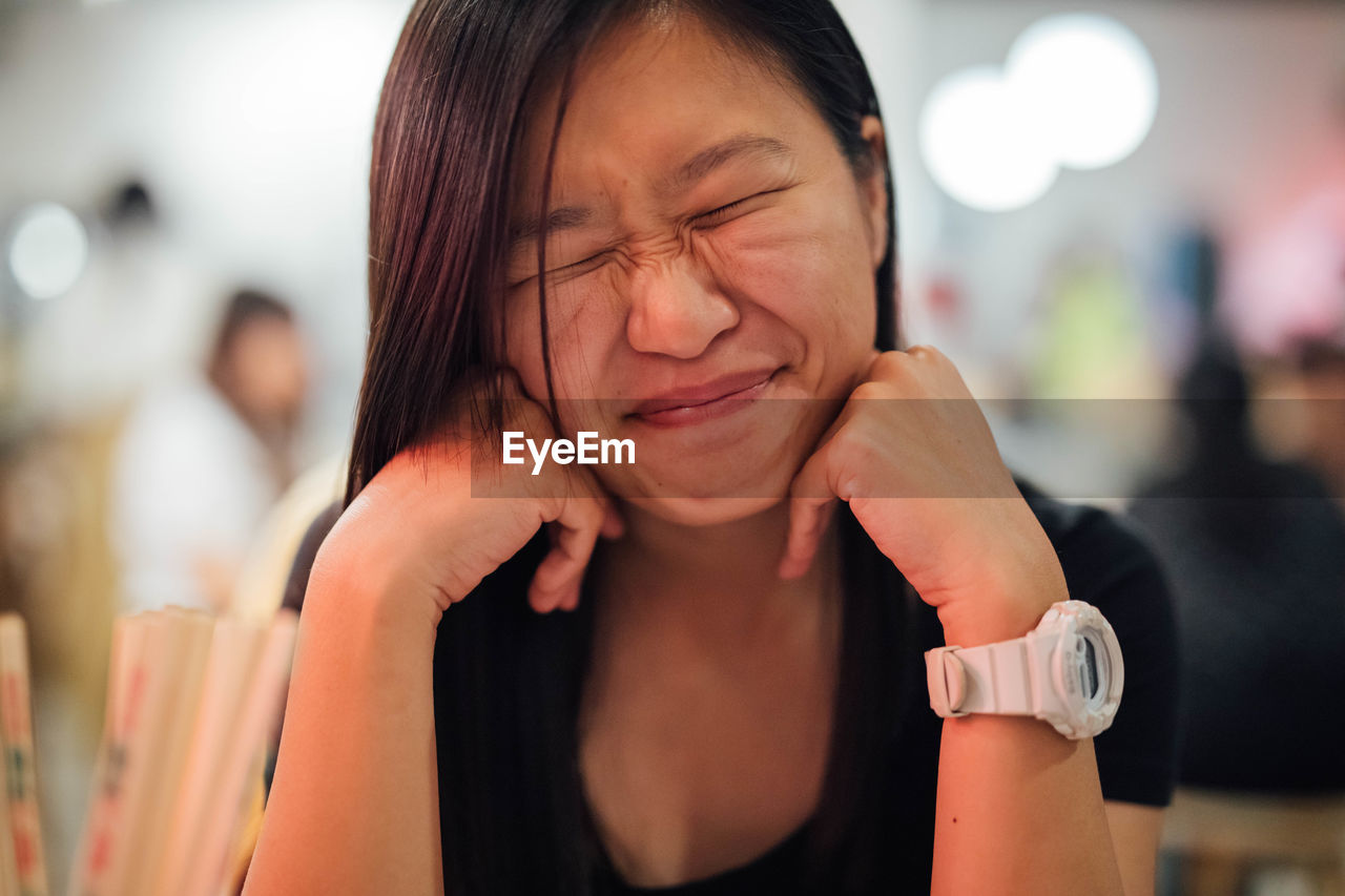 Close-up smiling woman with eyes closed