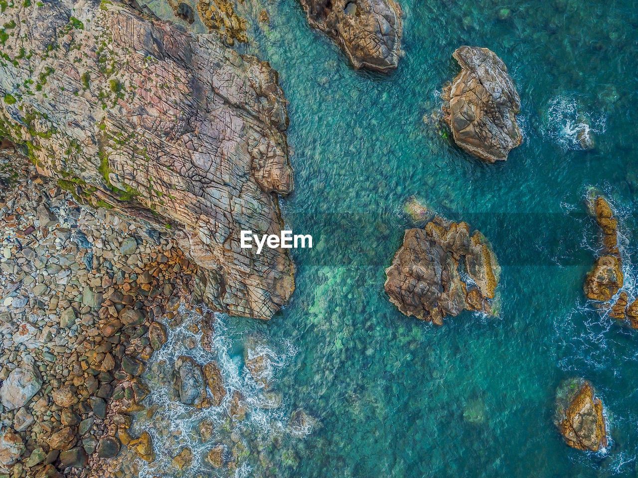 High angle view of rock formation in sea