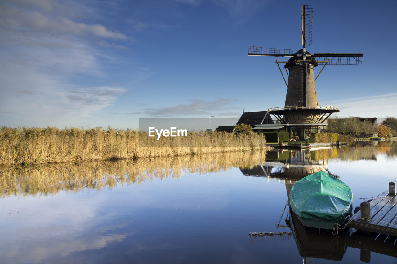 TRADITIONAL WINDMILL BY LAKE