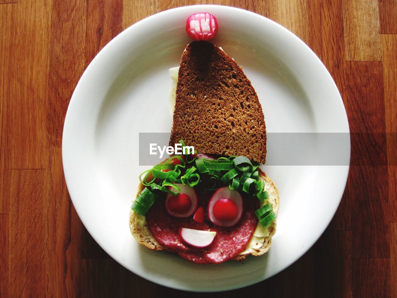 Plate with sandwich on table