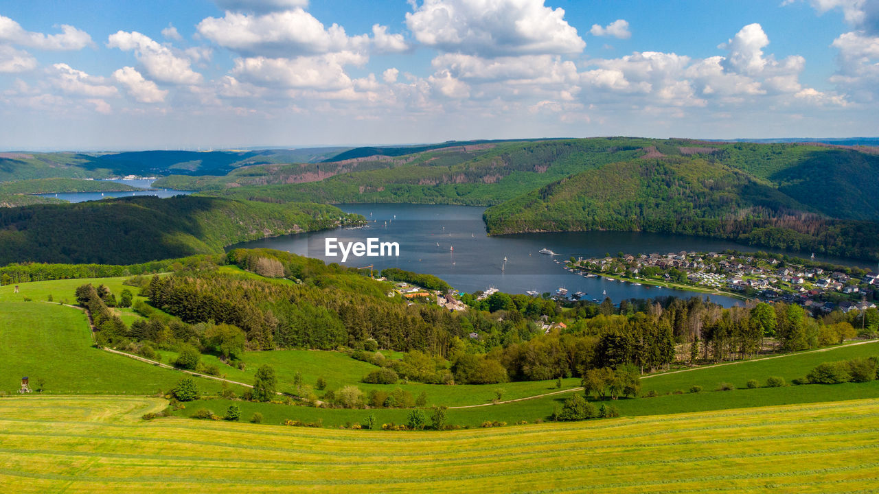 SCENIC VIEW OF GREEN LANDSCAPE AGAINST SKY