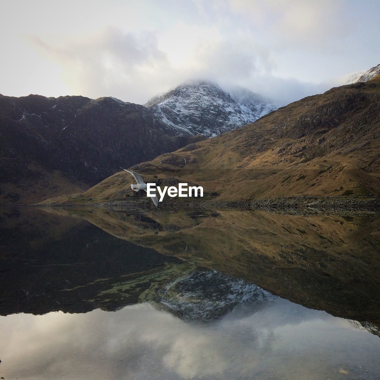 Scenic view of mountains and lake against sky