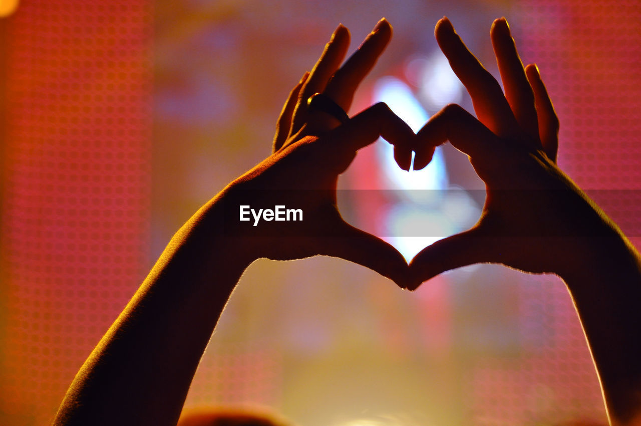 Close-up of hand holding heart shape