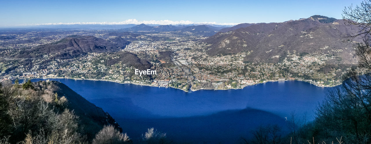 Aerial view of mountains against blue sky