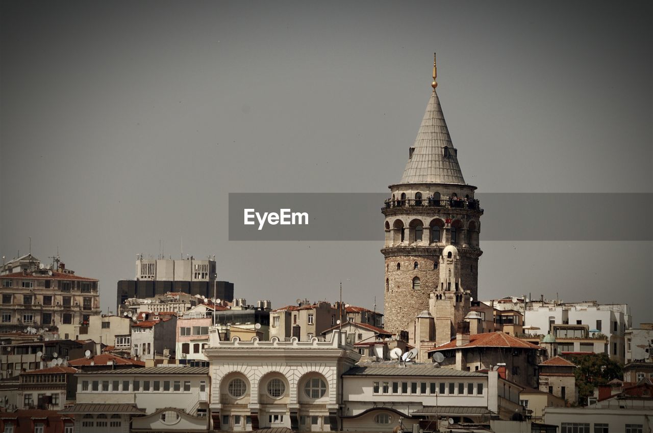 LOW ANGLE VIEW OF CLOCK TOWER IN CITY