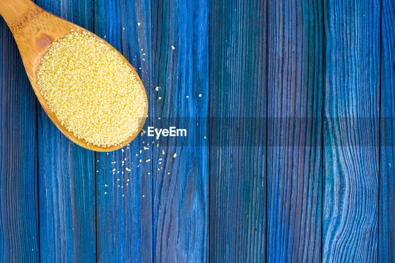 HIGH ANGLE VIEW OF FRESH BLUE WOODEN TABLE