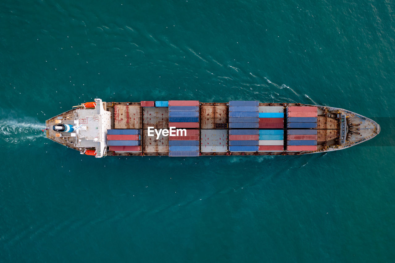 Aerial top view from drone, container ship or cargo shipping business service logistic import 