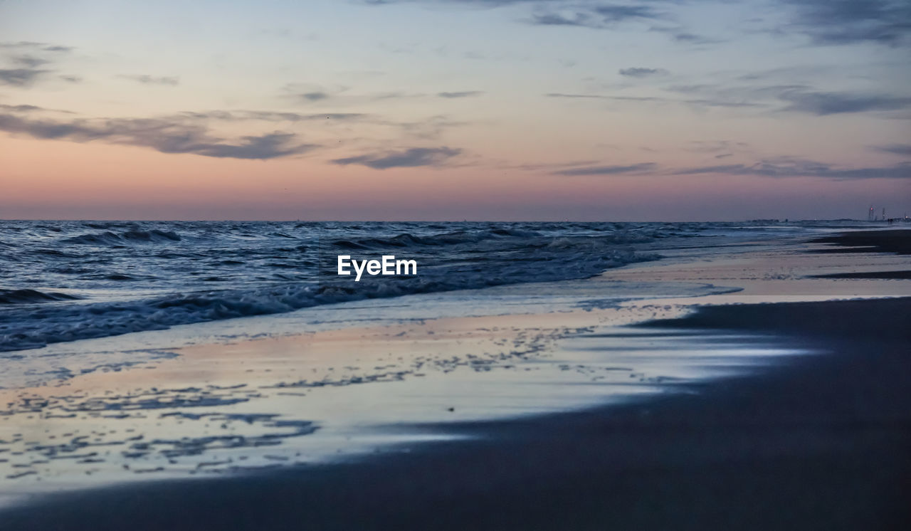 SCENIC VIEW OF SEA DURING SUNSET