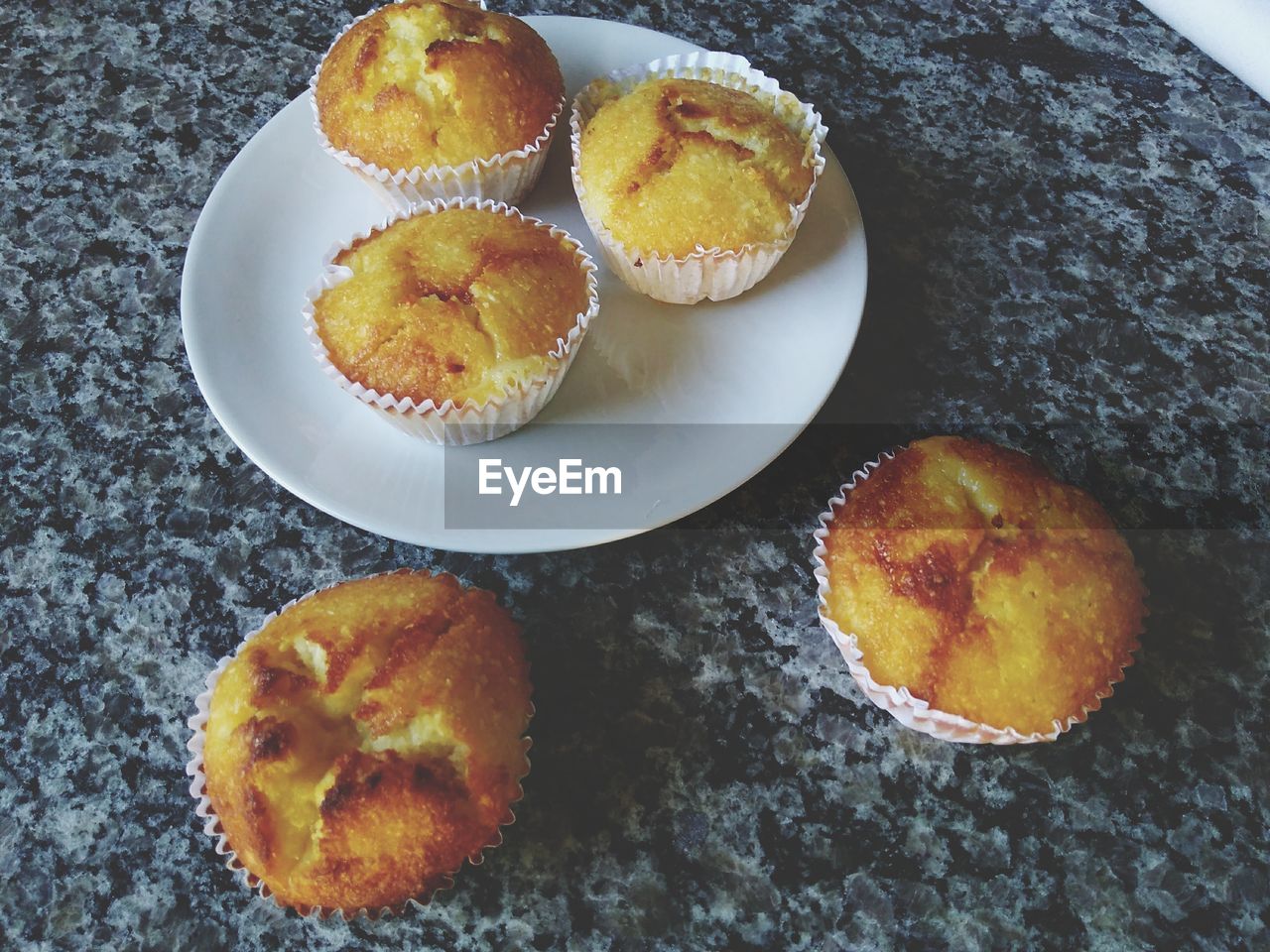 High angle view of muffins in plate on table