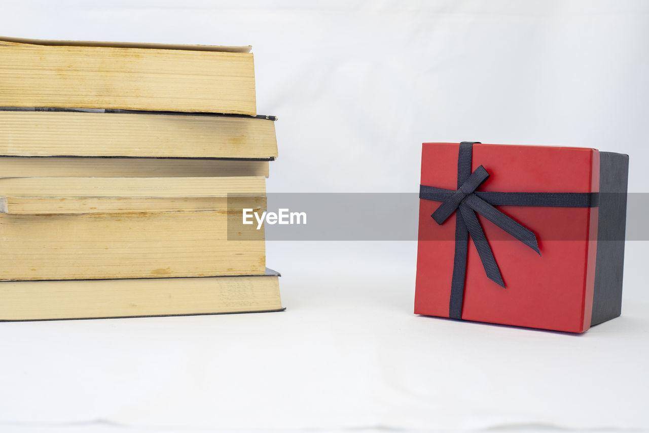 box, wood, red, indoors, no people, studio shot, paper, white background, furniture, book, group of objects, still life, publication