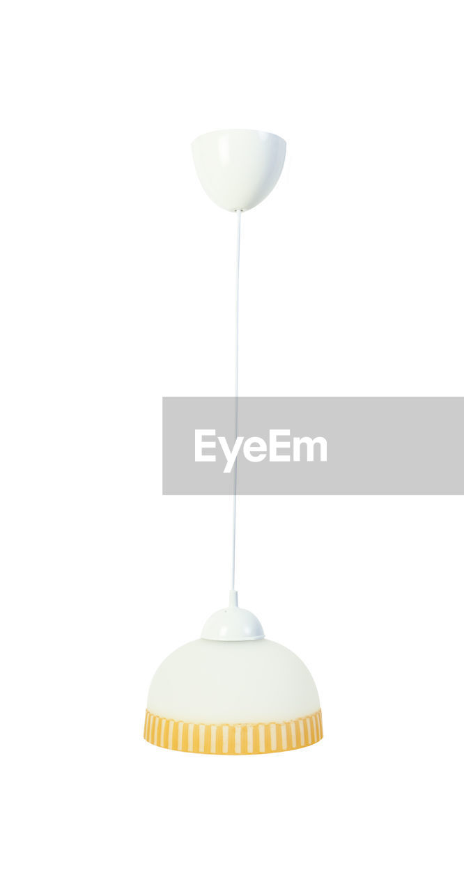 Close-up of pendant light against white background