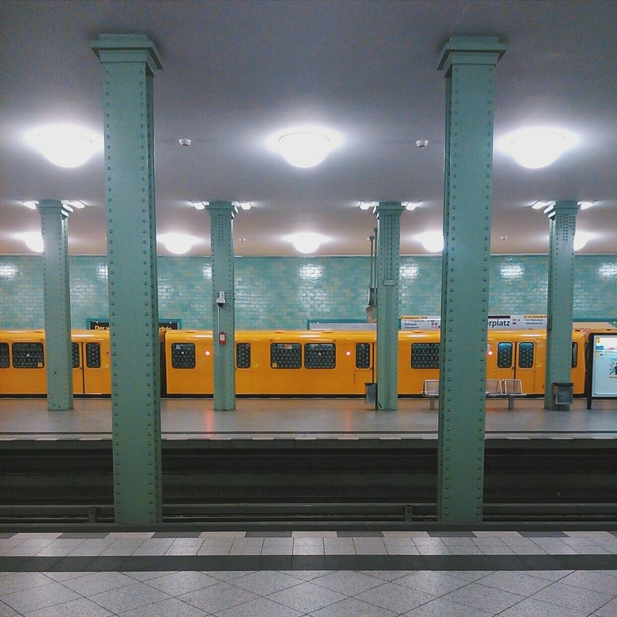 Yellow train at railway platform