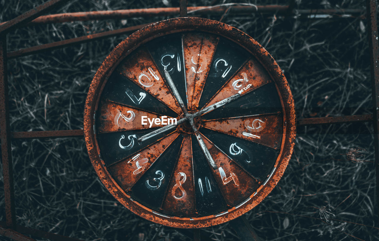 High angle view of old rusty play wheel