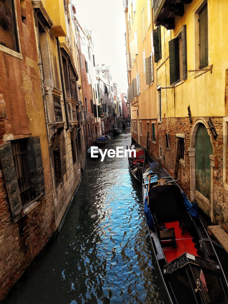 Canal amidst buildings in city