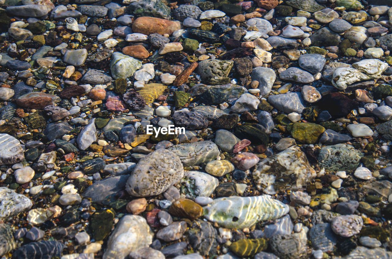 High angle view of pebbles underwater