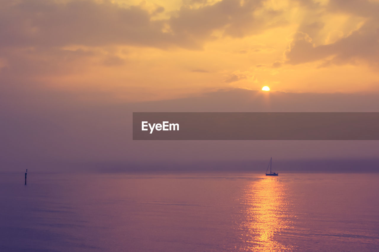 Scenic view of sea at sunset